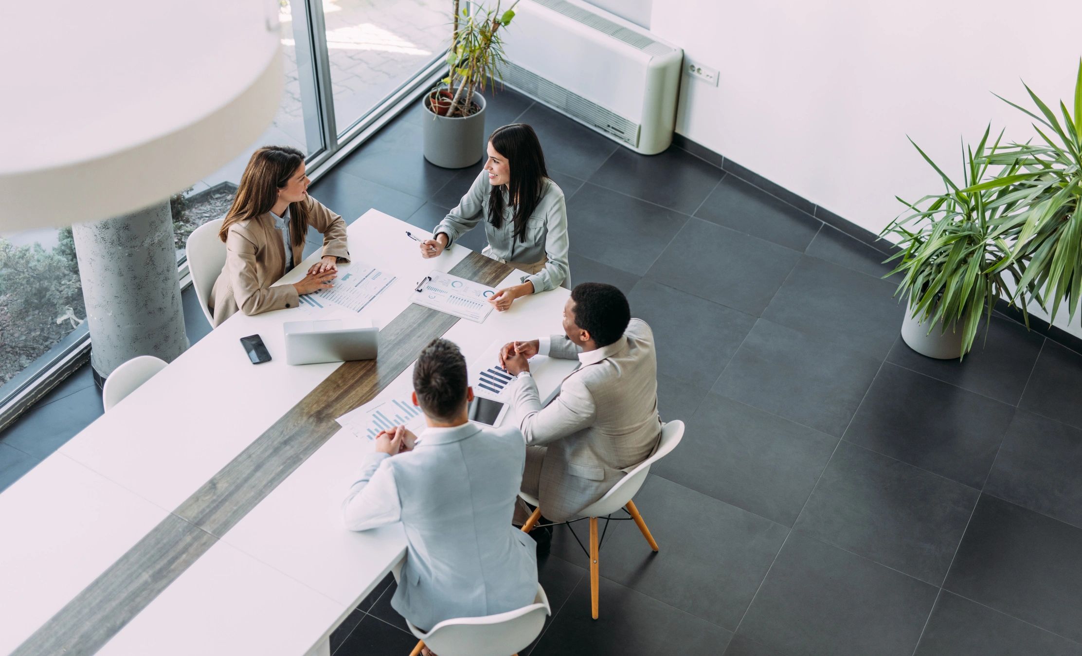 Professional staffing team collaborating around a conference table
